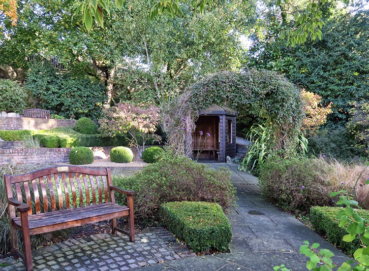 A garden with a bench in York